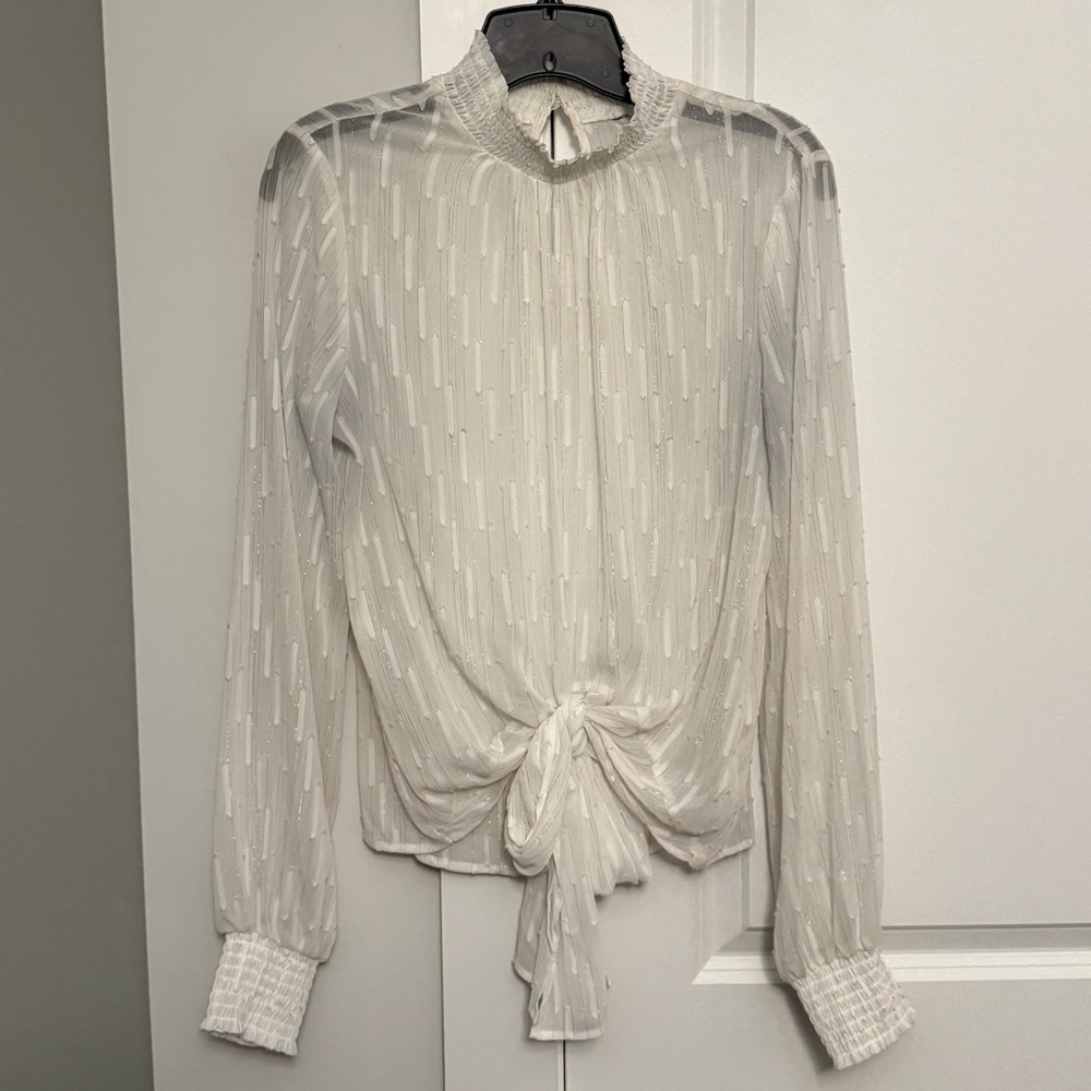 White and silver sheer Express blouse. Has a large tie on the front. Size small.